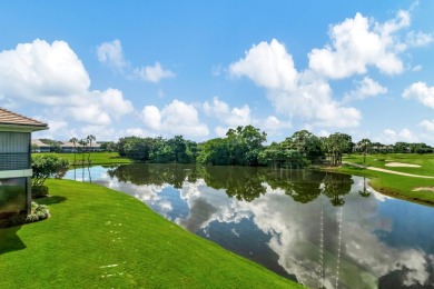 Charter Cay 2nd floor club villa with magnificent water and golf on Boca West Golf and Country Club in Florida - for sale on GolfHomes.com, golf home, golf lot