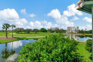 Charter Cay 2nd floor club villa with magnificent water and golf on Boca West Golf and Country Club in Florida - for sale on GolfHomes.com, golf home, golf lot