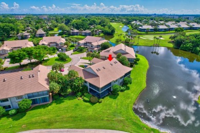 Charter Cay 2nd floor club villa with magnificent water and golf on Boca West Golf and Country Club in Florida - for sale on GolfHomes.com, golf home, golf lot