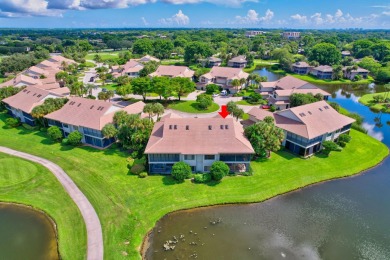 Charter Cay 2nd floor club villa with magnificent water and golf on Boca West Golf and Country Club in Florida - for sale on GolfHomes.com, golf home, golf lot