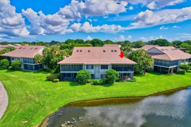 Charter Cay 2nd floor club villa with magnificent water and golf on Boca West Golf and Country Club in Florida - for sale on GolfHomes.com, golf home, golf lot