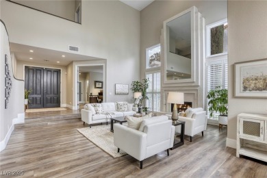 Floor-to-ceiling windows frame the lush greens of the 7th hole on Canyon Gate Country Club in Nevada - for sale on GolfHomes.com, golf home, golf lot