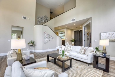 Floor-to-ceiling windows frame the lush greens of the 7th hole on Canyon Gate Country Club in Nevada - for sale on GolfHomes.com, golf home, golf lot