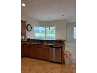 Rarely used 5 Bed/4 Bath POOL Home in GATED Community with GOLF on Kissimmee Bay Country Club in Florida - for sale on GolfHomes.com, golf home, golf lot