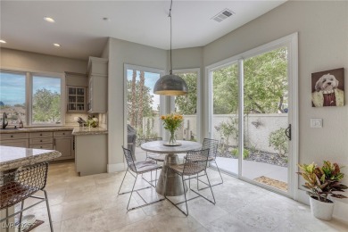 Floor-to-ceiling windows frame the lush greens of the 7th hole on Canyon Gate Country Club in Nevada - for sale on GolfHomes.com, golf home, golf lot