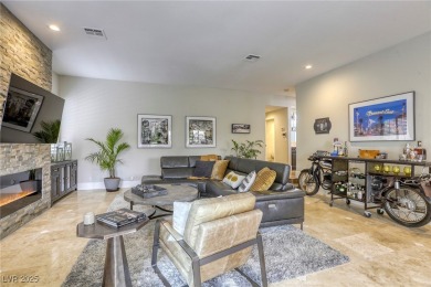 Floor-to-ceiling windows frame the lush greens of the 7th hole on Canyon Gate Country Club in Nevada - for sale on GolfHomes.com, golf home, golf lot