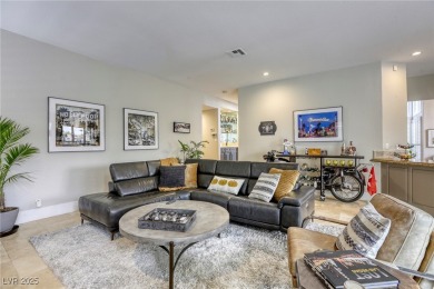 Floor-to-ceiling windows frame the lush greens of the 7th hole on Canyon Gate Country Club in Nevada - for sale on GolfHomes.com, golf home, golf lot