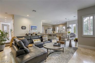 Floor-to-ceiling windows frame the lush greens of the 7th hole on Canyon Gate Country Club in Nevada - for sale on GolfHomes.com, golf home, golf lot