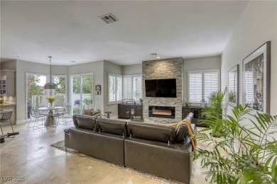 Floor-to-ceiling windows frame the lush greens of the 7th hole on Canyon Gate Country Club in Nevada - for sale on GolfHomes.com, golf home, golf lot