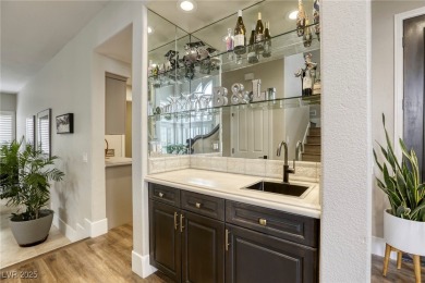 Floor-to-ceiling windows frame the lush greens of the 7th hole on Canyon Gate Country Club in Nevada - for sale on GolfHomes.com, golf home, golf lot