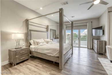 Floor-to-ceiling windows frame the lush greens of the 7th hole on Canyon Gate Country Club in Nevada - for sale on GolfHomes.com, golf home, golf lot