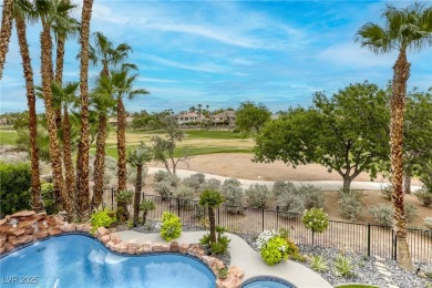 Floor-to-ceiling windows frame the lush greens of the 7th hole on Canyon Gate Country Club in Nevada - for sale on GolfHomes.com, golf home, golf lot