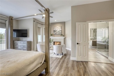 Floor-to-ceiling windows frame the lush greens of the 7th hole on Canyon Gate Country Club in Nevada - for sale on GolfHomes.com, golf home, golf lot