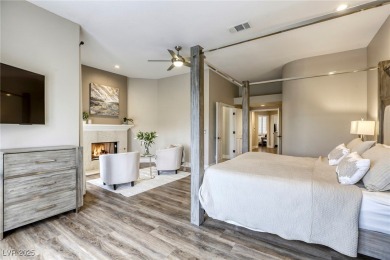 Floor-to-ceiling windows frame the lush greens of the 7th hole on Canyon Gate Country Club in Nevada - for sale on GolfHomes.com, golf home, golf lot