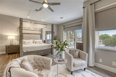 Floor-to-ceiling windows frame the lush greens of the 7th hole on Canyon Gate Country Club in Nevada - for sale on GolfHomes.com, golf home, golf lot