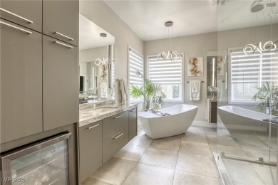 Floor-to-ceiling windows frame the lush greens of the 7th hole on Canyon Gate Country Club in Nevada - for sale on GolfHomes.com, golf home, golf lot