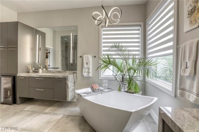 Floor-to-ceiling windows frame the lush greens of the 7th hole on Canyon Gate Country Club in Nevada - for sale on GolfHomes.com, golf home, golf lot