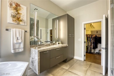 Floor-to-ceiling windows frame the lush greens of the 7th hole on Canyon Gate Country Club in Nevada - for sale on GolfHomes.com, golf home, golf lot