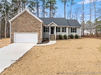 Built in 2024 and thoughtfully enhanced beyond the builder's on Carolina Trace Country Club in North Carolina - for sale on GolfHomes.com, golf home, golf lot