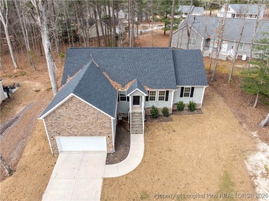 Built in 2024 and thoughtfully enhanced beyond the builder's on Carolina Trace Country Club in North Carolina - for sale on GolfHomes.com, golf home, golf lot