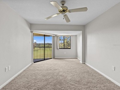 Discover the epitome of condominium living in this bright and on Tarpon Springs Golf Course in Florida - for sale on GolfHomes.com, golf home, golf lot