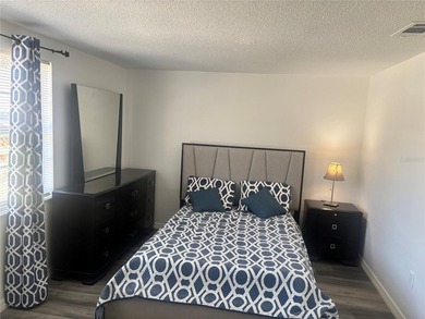 Welcome to this charming waterfront-view 2-bedroom, 2-bath on Beacon Woods Golf Club in Florida - for sale on GolfHomes.com, golf home, golf lot