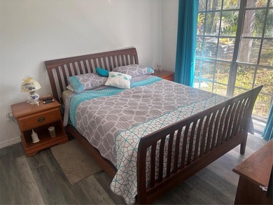 Welcome to this charming waterfront-view 2-bedroom, 2-bath on Beacon Woods Golf Club in Florida - for sale on GolfHomes.com, golf home, golf lot