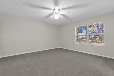 Under contract-accepting backup offers. Charming neighborhood on Green Valley Country Club in Florida - for sale on GolfHomes.com, golf home, golf lot