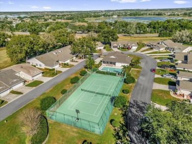 Under contract-accepting backup offers. Charming neighborhood on Green Valley Country Club in Florida - for sale on GolfHomes.com, golf home, golf lot