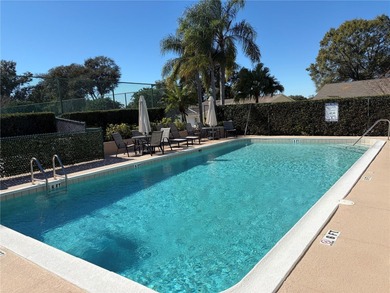 Under contract-accepting backup offers. Charming neighborhood on Green Valley Country Club in Florida - for sale on GolfHomes.com, golf home, golf lot