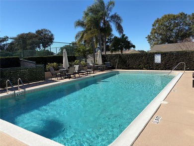 Under contract-accepting backup offers. Charming neighborhood on Green Valley Country Club in Florida - for sale on GolfHomes.com, golf home, golf lot