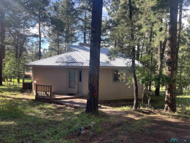 Take a look at this unique octagon home with easy year round on Pendaries Village Community Assoc. in New Mexico - for sale on GolfHomes.com, golf home, golf lot