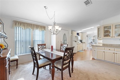 Fully furnished and spacious 27'x58' manufactured home. Built in on Maple Leaf Golf and Country Club in Florida - for sale on GolfHomes.com, golf home, golf lot