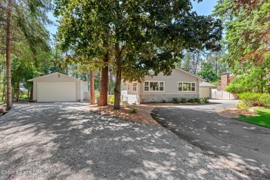 This beautifully updated 4 bed / 3 bath home sits on a spacious on Hayden Lake Country Club in Idaho - for sale on GolfHomes.com, golf home, golf lot