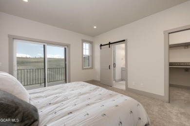 Tucked against a serene hillside in the coveted Grand Elk golf on Grand Elk Ranch and Club in Colorado - for sale on GolfHomes.com, golf home, golf lot