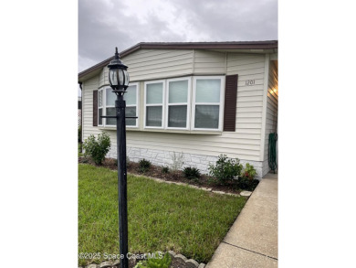 This property boasts numerous desirable features. New Roof 2023 on Barefoot Bay Golf Course in Florida - for sale on GolfHomes.com, golf home, golf lot