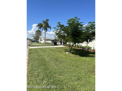This property boasts numerous desirable features. New Roof 2023 on Barefoot Bay Golf Course in Florida - for sale on GolfHomes.com, golf home, golf lot