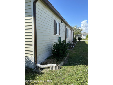 This property boasts numerous desirable features. New Roof 2023 on Barefoot Bay Golf Course in Florida - for sale on GolfHomes.com, golf home, golf lot