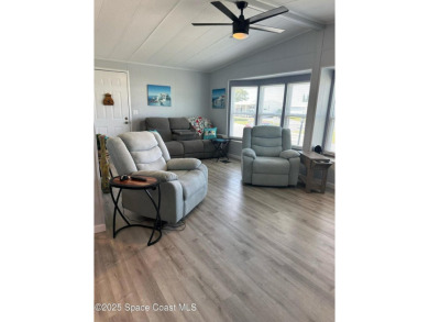 This property boasts numerous desirable features. New Roof 2023 on Barefoot Bay Golf Course in Florida - for sale on GolfHomes.com, golf home, golf lot