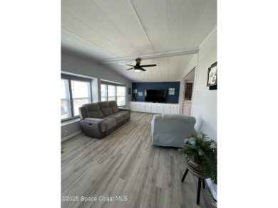 This property boasts numerous desirable features. New Roof 2023 on Barefoot Bay Golf Course in Florida - for sale on GolfHomes.com, golf home, golf lot