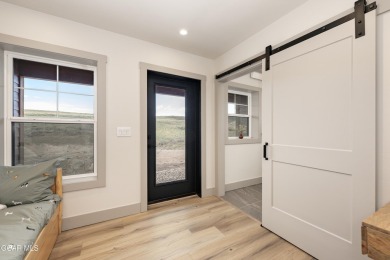 Tucked against a serene hillside in the coveted Grand Elk golf on Grand Elk Ranch and Club in Colorado - for sale on GolfHomes.com, golf home, golf lot