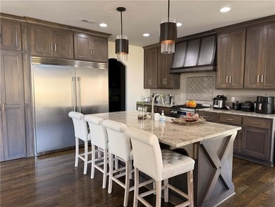 Welcome to an exceptional 1.5-story residence, perfectly on Tiffany Greens Golf Club in Missouri - for sale on GolfHomes.com, golf home, golf lot