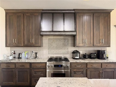 Welcome to an exceptional 1.5-story residence, perfectly on Tiffany Greens Golf Club in Missouri - for sale on GolfHomes.com, golf home, golf lot