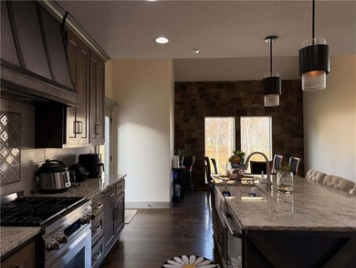 Welcome to an exceptional 1.5-story residence, perfectly on Tiffany Greens Golf Club in Missouri - for sale on GolfHomes.com, golf home, golf lot