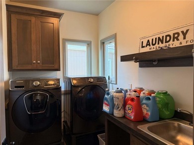 Welcome to an exceptional 1.5-story residence, perfectly on Tiffany Greens Golf Club in Missouri - for sale on GolfHomes.com, golf home, golf lot