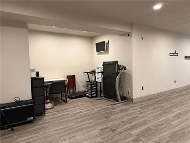 Welcome to an exceptional 1.5-story residence, perfectly on Tiffany Greens Golf Club in Missouri - for sale on GolfHomes.com, golf home, golf lot