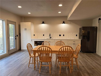 Welcome to an exceptional 1.5-story residence, perfectly on Tiffany Greens Golf Club in Missouri - for sale on GolfHomes.com, golf home, golf lot