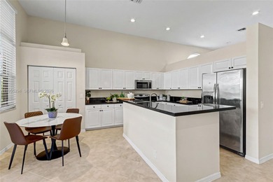 An elegant single-story Mediterranean-style pool home on TPC Eagle Trace in Florida - for sale on GolfHomes.com, golf home, golf lot