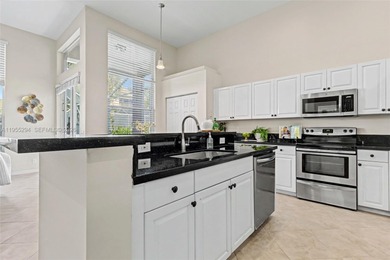 An elegant single-story Mediterranean-style pool home on TPC Eagle Trace in Florida - for sale on GolfHomes.com, golf home, golf lot