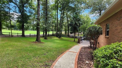 Discover this beautifully crafted 4-bedroom, all-brick home in on Landings Golf Club in Georgia - for sale on GolfHomes.com, golf home, golf lot